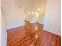 Spacious living area with gleaming hardwood floors and high ceilings at 6025 Ashbury Ln, Cumming, GA 30028