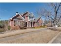 Attractive brick home with a side-entry garage, a well-kept lawn, and mature trees at 1279 Saxony Se Dr, Conyers, GA 30013