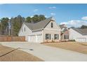 Desirable home showcasing a three-car garage and a blend of brick and stone on its charming facade at 2808 Blandwood Rd, Marietta, GA 30064