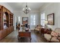 Spacious office with hardwood floors, built-in bookshelves, and natural light at 3980 Saint Elisabeth Sq, Duluth, GA 30096
