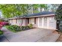 Side view of a charming home with an extra parking area and manicured landscaping adding to its appeal at 1263 Briarcliff Ne Rd, Atlanta, GA 30306
