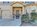 Inviting entrance with a stone facade, covered porch, and meticulously landscaped surroundings at 1465 Forest Brook Trl, Cumming, GA 30041