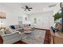 Comfortable living room with hardwood floors, a gray sectional sofa, and a view of the front door at 2599 Church Nw St, Atlanta, GA 30318