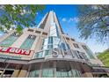 Upscale building entrance featuring modern architecture, retail space, and prominent signage at 860 Peachtree Ne St # 1502, Atlanta, GA 30308