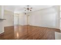 Open-concept living area with hardwood floors, white trim, and plenty of natural light at 4124 Berwick Farm Dr, Duluth, GA 30096