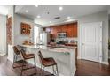 Kitchen featuring a breakfast bar with marble countertop and a wine rack for storage at 565 Peachtree St # 1311, Atlanta, GA 30308
