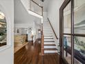 Bright foyer with hardwood floors, high ceilings, and a staircase with wood railing at 1080 Bailiff Ne Ct, Brookhaven, GA 30319