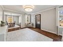 Spacious living room with hardwood floors, a view into dining room, and natural light at 1784 Hickory Rd, Atlanta, GA 30341