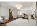 Bright living room featuring hardwood floors, a neutral color scheme, and a work desk at 1784 Hickory Rd, Atlanta, GA 30341