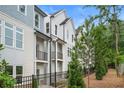 Beautiful new construction townhomes showcase modern design with balconies and manicured landscaping at 484 Hammons Way, Atlanta, GA 30315