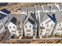 Aerial view of newly constructed townhomes with similar architectural design and landscaping at 484 Hammons Way, Atlanta, GA 30315