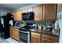 Functional kitchen featuring modern appliances, ample cabinet space, and granite countertops at 637 Outlook Way, Atlanta, GA 30349
