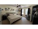 Bright bedroom with ceiling fan, comfortable bed, and plenty of natural light at 637 Outlook Way, Atlanta, GA 30349