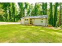 Beautifully renovated home with a new porch, nestled in a lush, green yard at 2493 Swallow Cir, Atlanta, GA 30315