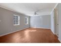 Bright living room with hardwood floors, neutral walls, and a ceiling fan at 413 Northdale Ct, Lawrenceville, GA 30046