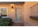 Close-up of a contemporary front door with sleek design and modern hardware at 3401 Lori Ln, Atlanta, GA 30340