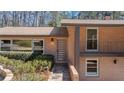 Modern brick home with a stylish front door, complemented by well-maintained landscaping at 3401 Lori Ln, Atlanta, GA 30340