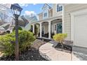 Inviting front porch with white columns, a walkway, and professional landscaping at 2230 Rosemoore Walk, Marietta, GA 30062