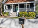 View of a mailbox, steps, and the front porch with a swing of this beautiful home at 1216 Mortimer Se Pl, Atlanta, GA 30317