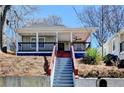Charming bungalow with inviting front porch, and a classic, landscaped yard at 543 Paines Nw Ave, Atlanta, GA 30318