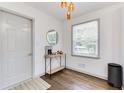 Bright entryway with hardwood floors, a console table, decorative lighting and a large window at 1300 Wichita Sw Dr, Atlanta, GA 30311