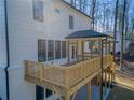 A wooden deck and patio area is showcased, extending from the back of this new build at 1977 Westwood Se Cir, Smyrna, GA 30080