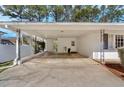 Covered carport and entry way with painted brick and rod iron at 161 Diane Se Dr, Smyrna, GA 30082