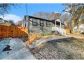 This home features updated windows, wooden fence, and a well-maintained front yard at 2178 Penelope Nw St, Atlanta, GA 30314