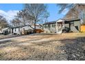 View of the home with a large yard and mature trees in a neighborhood setting at 2178 Penelope Nw St, Atlanta, GA 30314