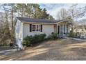 An exterior elevation view shows the architectural style and landscaped yard of this lovely home at 4196 Rocky Face Dr, Douglasville, GA 30135