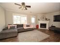 Bright living room with a fireplace, large windows, and modern furnishings at 5647 Executive Way, Norcross, GA 30071
