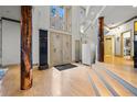 An open foyer with hardwood flooring, a decorative water feature, and access to the upper and lower levels at 4000 Wieuca Rd Ne, Atlanta, GA 30342