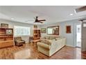Inviting living room featuring hardwood floors, natural light, and a neutral color palette for a cozy ambiance at 7030 Cascade Palmetto Hwy, Palmetto, GA 30268
