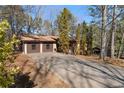View of house featuring a nice driveway and a 2-car garage at 28 East Boxwood Dr, Cartersville, GA 30121