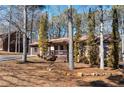 Charming single story home with a cozy front porch and a well maintained front yard at 28 East Boxwood Dr, Cartersville, GA 30121