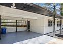 Attached carport offering covered parking, painted white, and adjacent to the home's exterior at 4425 Cascade Sw Rd, Atlanta, GA 30331