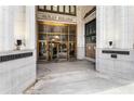 Building entrance featuring glass doors, exterior architecture and stone finishes at 57 Forsyth Nw St # 5F, Atlanta, GA 30303