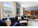 Stylish living room with large windows, plush seating and a dining area at 57 Forsyth Nw St # 5F, Atlanta, GA 30303