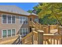 Lovely home showcasing a multi-tiered deck with views of the private backyard at 305 Mill Pond Se Ct, Smyrna, GA 30082