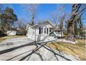 Charming home featuring a brick facade, black shutters, and a cozy front porch sitting area at 850 Third St, Stone Mountain, GA 30083