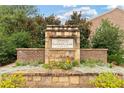 The Terraces at Cumberland community sign is surrounded by beautiful landscaping and stonework at 2289 Emerald Sky Dr, Smyrna, GA 30080