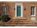 Stately brick home entrance features a green front door, sidelights, and brick steps at 270 Grapevine Run, Sandy Springs, GA 30350