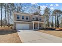Traditional two-story brick home with a well-maintained lawn and inviting driveway at 249 Chiswick Loop, Stockbridge, GA 30281