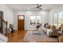 Cozy living room features hardwood floors, a neutral color scheme, and large windows at 624 3Rd Ave, Decatur, GA 30030