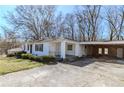 Exterior of home featuring attached covered parking and front yard landscaping at 8523 Duncan St, Douglasville, GA 30134