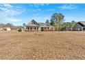 Single-Gathering home featuring horizontal siding and expansive front yard, inviting suburban charm at 17 Denny Springs Dr, Dallas, GA 30157