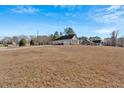 Horizontal siding home with a detached garage, set on a sprawling lawn for ample outdoor space at 17 Denny Springs Dr, Dallas, GA 30157