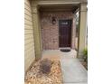 A close-up view of the front door, highlighting the brickwork and covered entrance at 1366 Image Xing, Lawrenceville, GA 30045