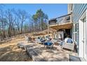 Spacious outdoor patio featuring cozy seating, dining area, and a second-story deck at 139 Stargaze Rdg, Canton, GA 30114