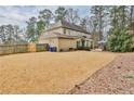 Large backyard with an expansive lawn, a covered patio, and mature trees at 2998 Octavia Cir, Marietta, GA 30062